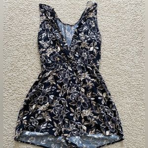 Old navy black, floral romper with pockets. Size medium, but fits like a large.